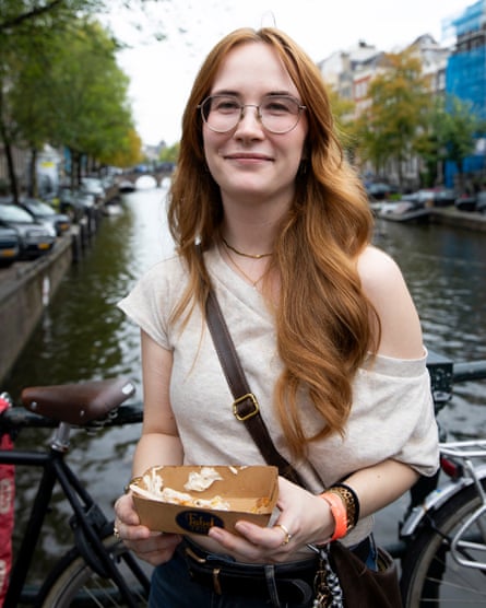 Natalie Stübben standing on a bridge with a canal in the background.