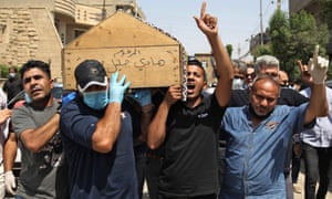 Mourners carry coffin