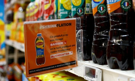 A sign on the shelf of a Carrefour supermarket near Paris warns: ‘Shrinkflation, This product has seen its litre decrease and the price charged by our supplier increase.’