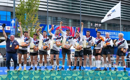 Great Britain fist pump on the podium with their gold medals after winning the men’s outdoor 640kg competition of tug of war event at the 2025 World Games in Chengdu, China