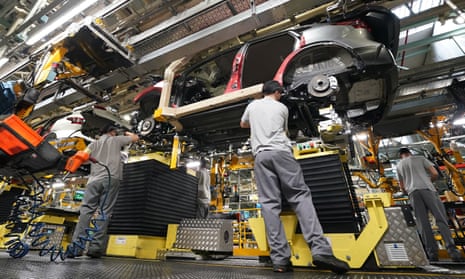 Workers on the production line at Nissan's factory in Sunderland.
