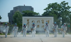Members of the Beijing Blue Sky Rescue team conduct disinfection at the China Meat Food Research Center in Fengtai District of Beijing, capital of China, 21 June 2020.