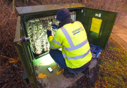 A BT Openreach engineer works on upgrading a telephone exchange to superfast broadband near Livingston West Lothian