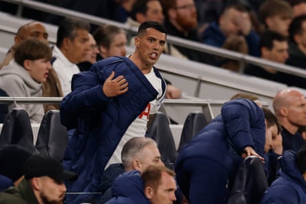 Pedro Porro looks upset on the Tottenham bench