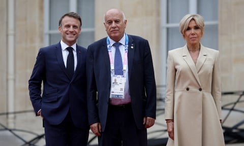 Jibril Rajoub, centre, with Emmanuel Macron (L) and his wife Brigitte Macron at the Elysee presidential palace.