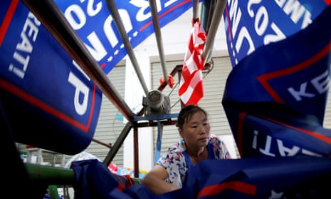A worker at Jiahao flag factory in China makes flags for Donald Trump’s “Keep America Great!” 2020 re-election campaign.