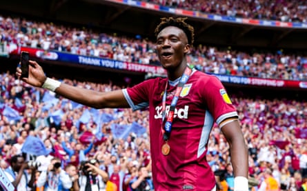Tammy Abraham celebrates after Aston Villa win promotion from the Championship