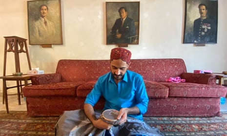Artist Zulfikar Ali Bhutto sews an Indus River dolphin into a textile work.