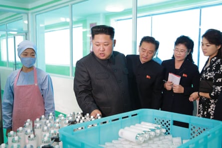 Kim inspects bottles at the factory.