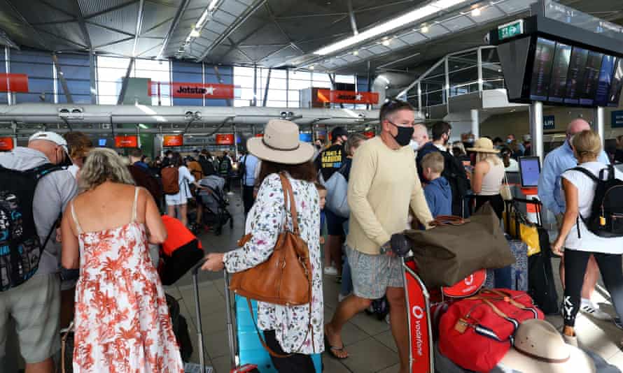 People queue on arrival at Sydney domestic airport ahead of the Easter long weekend