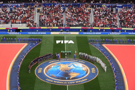 Players of Spain (left) and Austria line up for their national anthems.