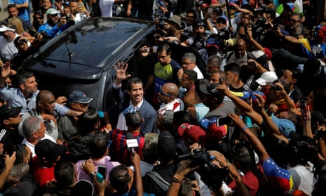 Juan Guaidó waves to supporters during a rally in Caracas.