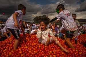 A child cries after being hit in the middle of tomatoes