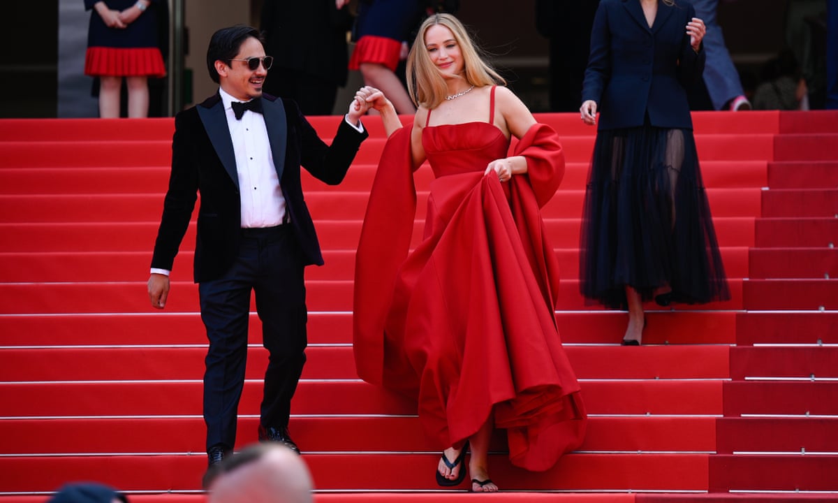 jennifer lawrence red carpet red dress Jennifer Lawrence wows in Cannes wearing red dress and flip flops