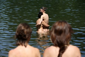 Berlin, Germany: Naked visitors enjoy Teufelssee lake during hot summer weather temperatures