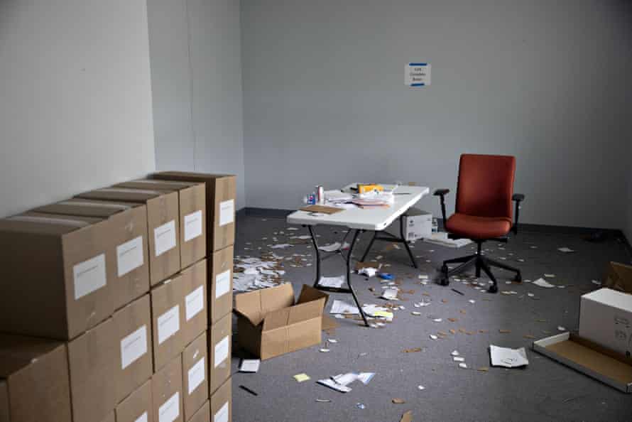 Papers cover the floor near boxes of voter registration forms inside an auxiliary Iowa Democratic Party office in Des Moines, Iowa, U.S., on Tuesday, Feb. 4, 2020.
