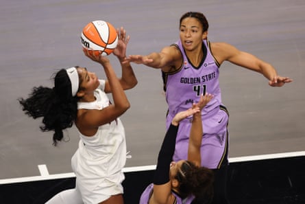Atlanta’s Angel Reese shoots over Golden State’s Kiah Stokes and Veronica Burton during the fourth quarter of Game 4 of the WNBA finals on Saturday at State Farm Arena in Atlanta.