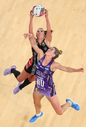 Kelsey Browne of the Magpies and Gabi Simpson of the Firebirds compete for the ball during the round 9 Super Netball match between the Magpies and the Firebirds at Melbourne Arena on June 23, 2019 in Melbourne, Australia.