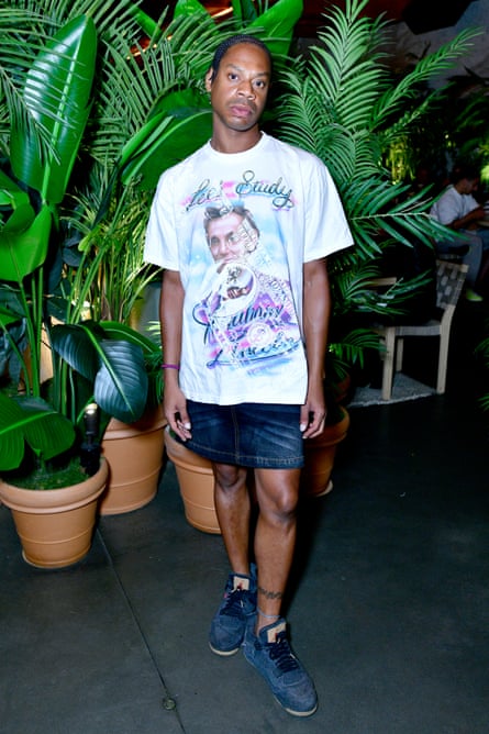 man in front of plants