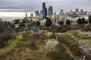 A homeless encampment, known informally as “Dope Slope” stands covered in garbage near downtown Seattle, Washington. The city government is currently working to remove such encampments from shared spaces throughout Seattle. According to a recent report commissioned by Seattle Council member Andrew Lewis, the COVID-19 pandemic put undue pressure on the city’s shelter system and delayed funds for new housing, leading to an increase in homelessness.