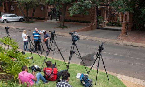 Journalists wait outside the home of Oscar Pistorius’s uncle in Waterkloof, Pretoria, after the court ruling.