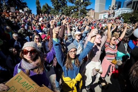 people hold up their hands outside
