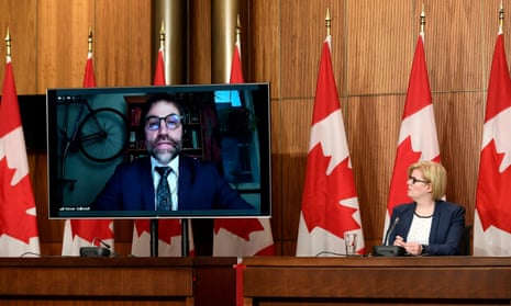 Canada’s environment minister, Steven Guilbeault, addresses a news conference via video with the offending bicycle in the background earlier this month.