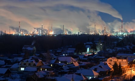 Flue gas and steam rise out of chimneys and smokestacks of an oil refinery during sunset on a frosty day in the Siberian city of Omsk, Russia, 8 February 2023