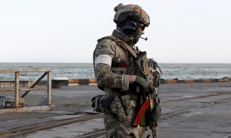 A Russian serviceman at the port in Mariupol