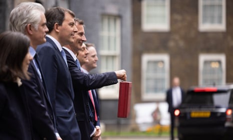 Jeremy Hunt leaves 10 Downing Street to present his spring budget to parliament.