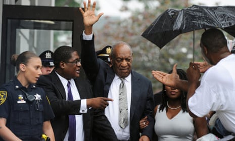 Bill Cosby waves as he leaves the courthouse in Norristown, Pennsylvania.