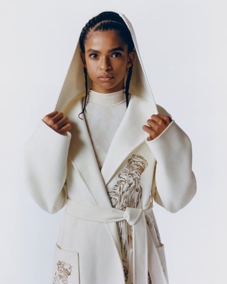 Portrait of Ramla Ali in white coat with hood.