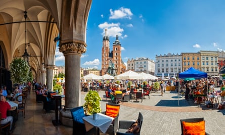 Main market square of Krakow from under the arches of the Cloth Hall.