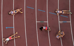 Athletes attempt to recover from the effort of the the women’s 3,000m steeplechase final.
