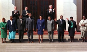 The Little Rock Nine: Thelma Mothershed Wair, Minnijean Brown Trickey, Jefferson Thomas, Terrence Roberts, Carlotta Walls LaNier, Gloria Ray Karlmark, Ernest Green, Elizabeth Eckford and Melba Pattillo Beals on the steps of Little Rock’s Central High with Bill Clinton.