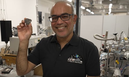 Prof Mahesh Anand holds a piece of lunar rock