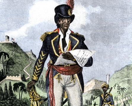 an image of a man in a suit and hat standing near mountains