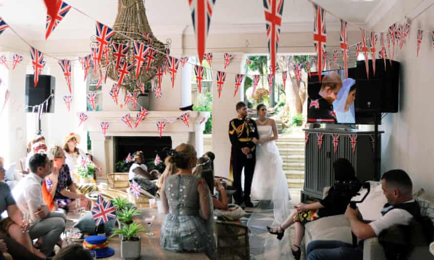 People in Durban, South Africa, watching the wedding of Prince Harry and Meghan Markle in 2018.