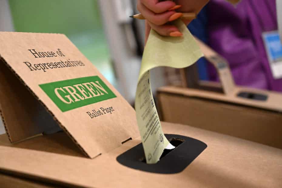 A ballot paper being placed into a ballot box in the 2022 Australian federal election
