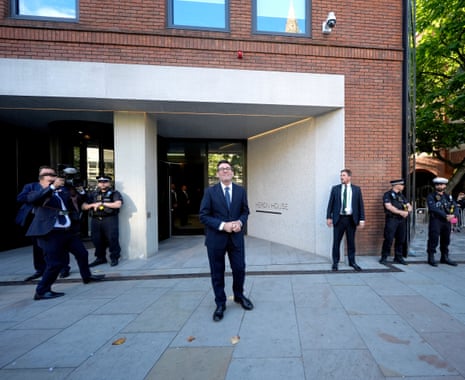 Andy Burnham stands smiling outside No 1o North