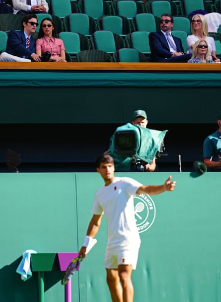 Louis Partridge, Olivia Rodrigo, Dave Grohl and Jordyn Blum in the stands above Carlos Alcaraz at Wimbledon