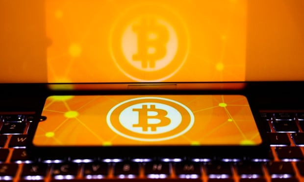Bitcoin cryptocurrency logo is displayed on a mobile phone screen