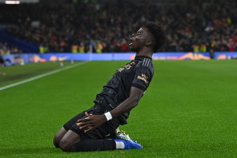 Arsenal's English midfielder Bukayo Saka celebrates after scoring the opening goal of the English Premier League football match between Brighton and Hove Albion and Arsenal.