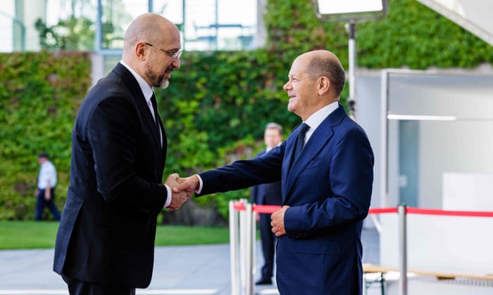 German Chancellor, Olaf Scholz, welcomes Ukraine's prime minister, Denys Shmyhal, in front of the Chancellery in Berlin on Sunday