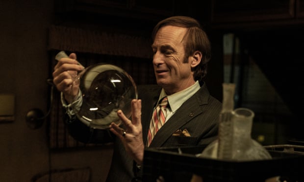Bob Odenkirk as Saul Goodman, examining Walt and Jesse’s round bottomed flask.