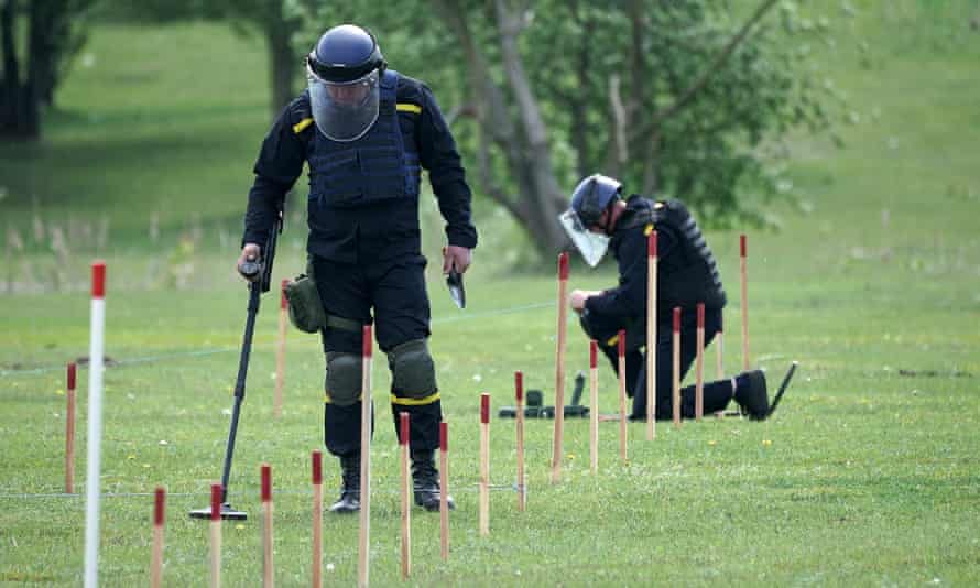 Russia-Ukraine war: experts warn of ‘serious and imminent’ risk of Ukraine genocide – live 7 Ukrainian bomb disposal experts and de-mining teams in Horenka suburb in Kyiv, Ukraine.