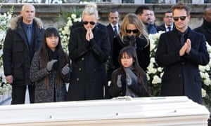 Johnny Hallyday’s wife and children stand in front of his coffin outside La Madeleine church in Paris