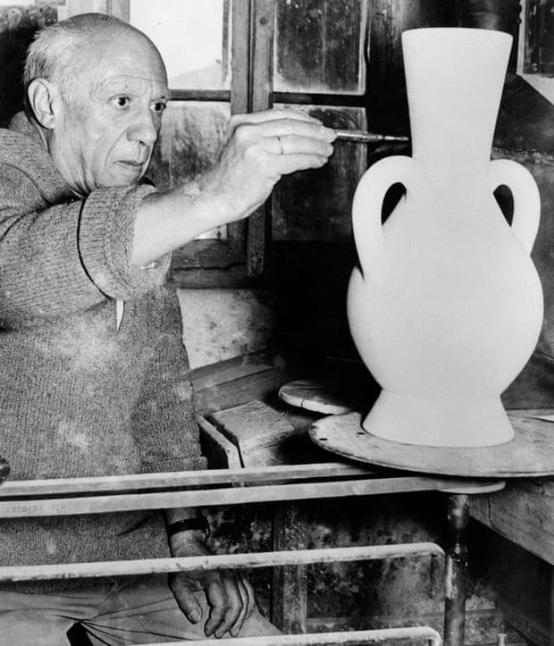 Pablo Picasso painting a vase at the Madoura pottery studio in Vallauris.