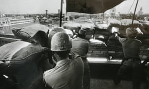 Indian soldiers take positions from a building adjoining the Golden Temple during Operation Blue Star in 1984.