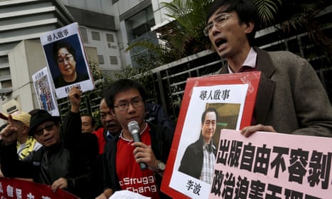 Pro-democracy protesters in Hong Kong with a picture of Lee Bo